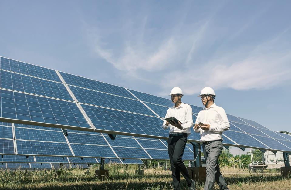 men working on solar panels