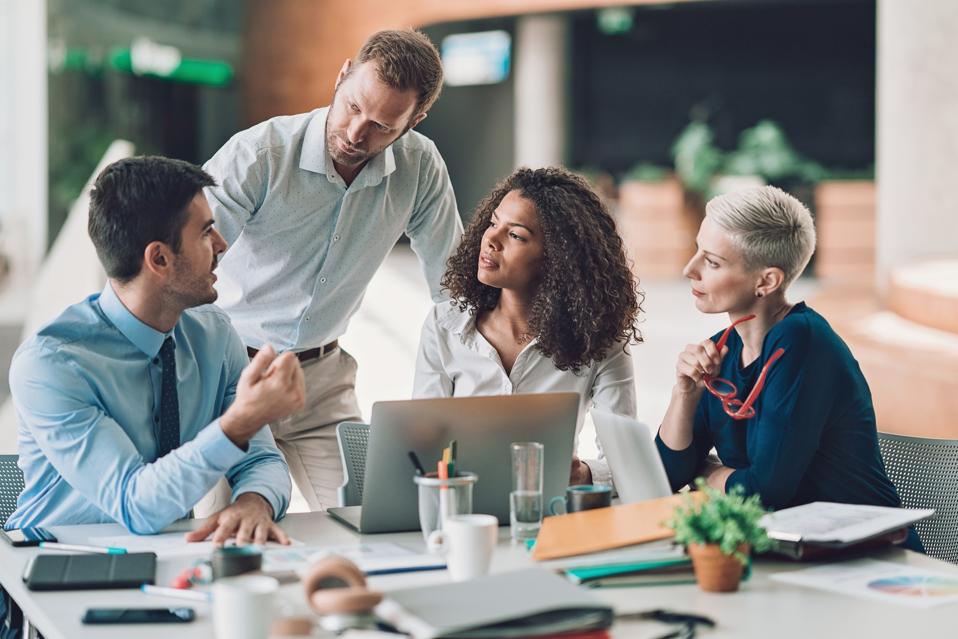 Group of entrepreneurs talking on a meeting