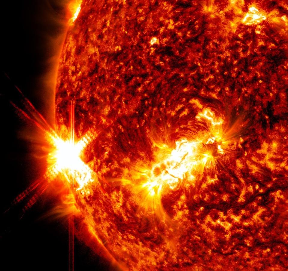 NASA’s Solar Dynamics Observatory captured this image of a solar flare – as seen in the bright flash on the left side of the image – on Jan. 9, 2023. The image shows a subset of extreme ultraviolet light that highlights the extremely hot material in flares and is colorized in red and gold.