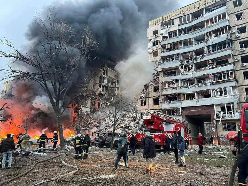 Smoke rises after a Russian rocket hit a multistory building.