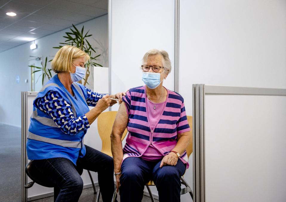 A senior being vaccinated.