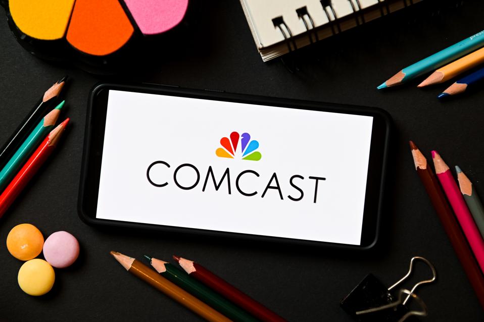 En esta ilustración fotográfica, se muestra el logotipo de Comcast en...