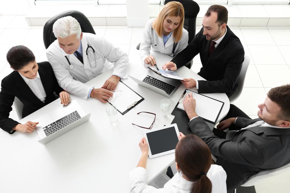 Team,Of,Doctors,Working,In,Clinic