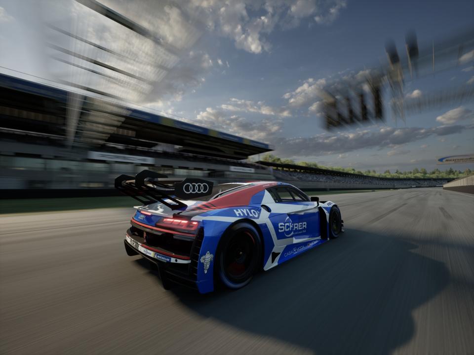 Скріншот Rennsport, на якому зображено гоночний автомобіль Audi, що їде на високій швидкості по іподрому