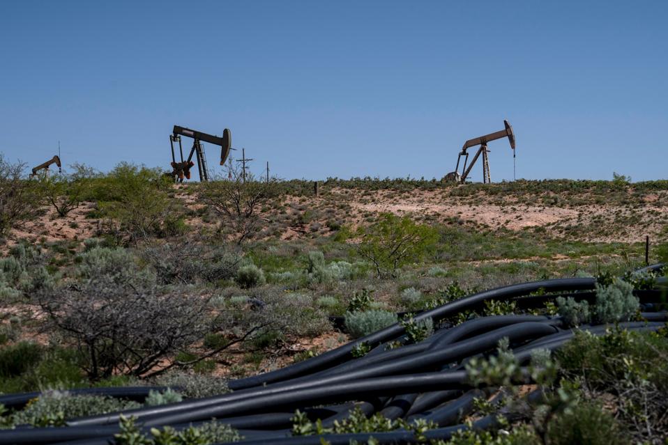 Photo of pump jacks in Permian basin of New Mexico.