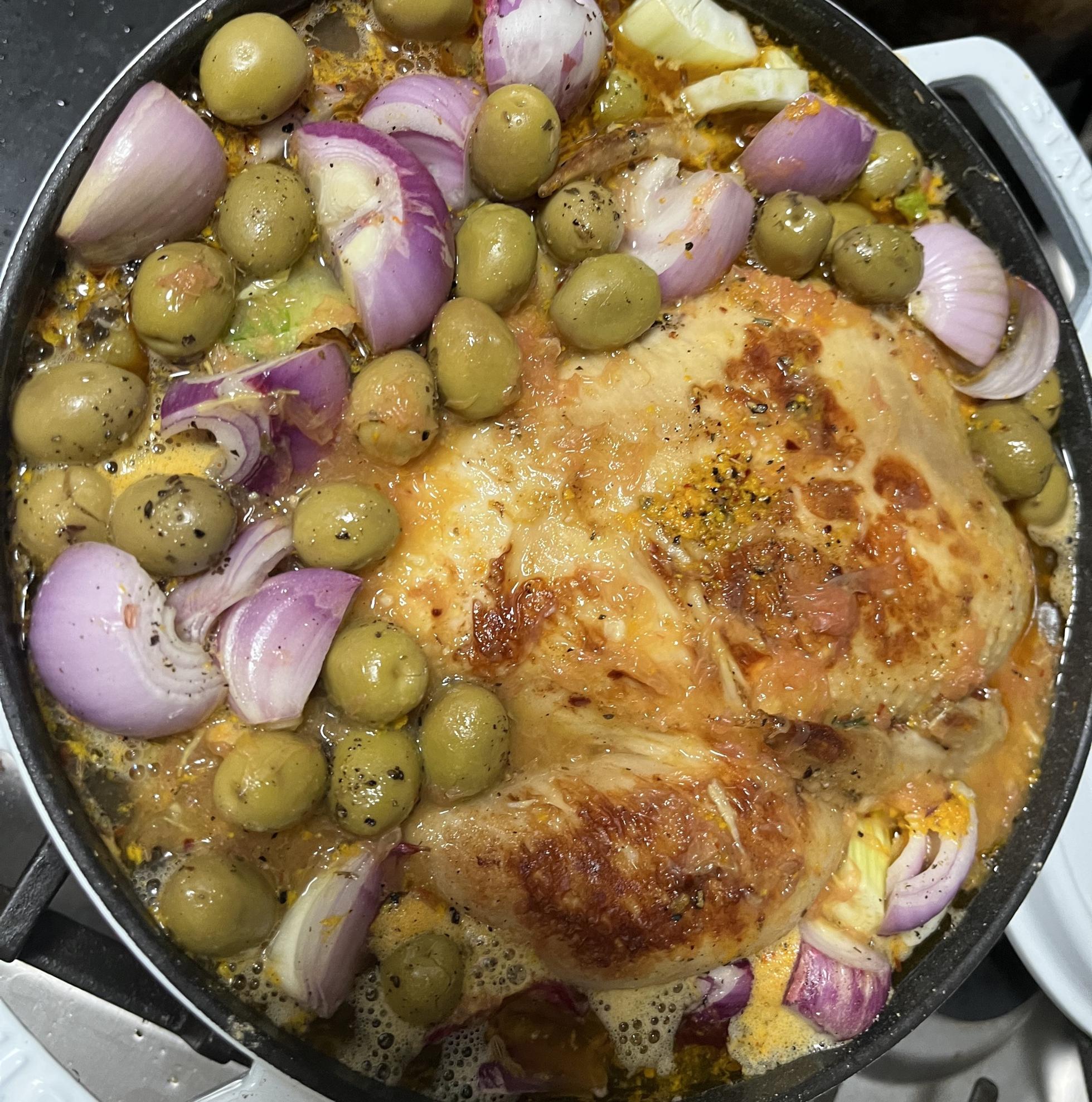 An antibiotic-free chicken, roasting in its juices.