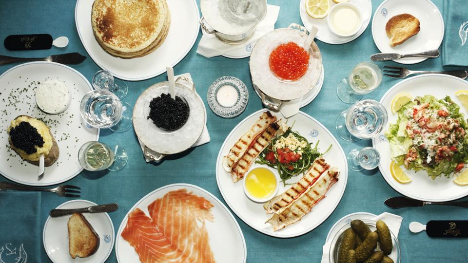 A spread of dishes from Caviar Kaspia at The Mark