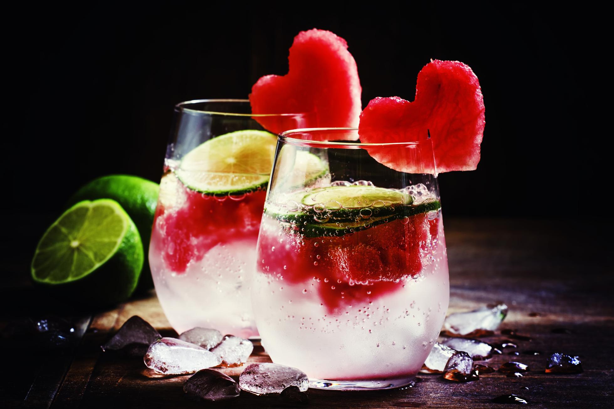 Valentine's Day cocktail with red fruit hearts=