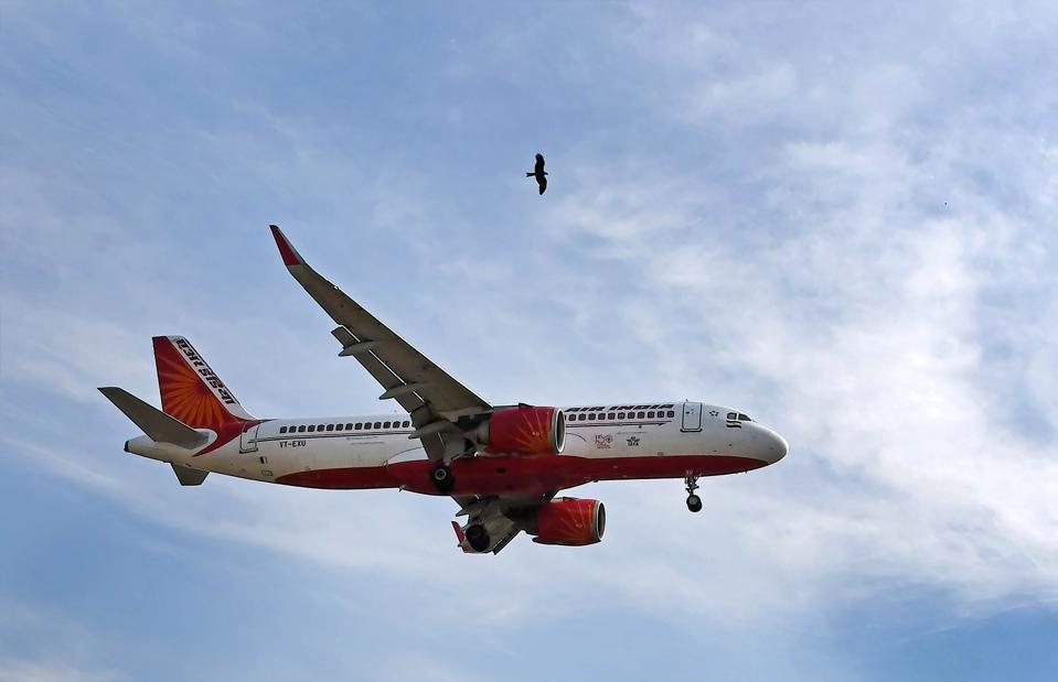 An Air India plane seen flying in the sky in Mumbai...