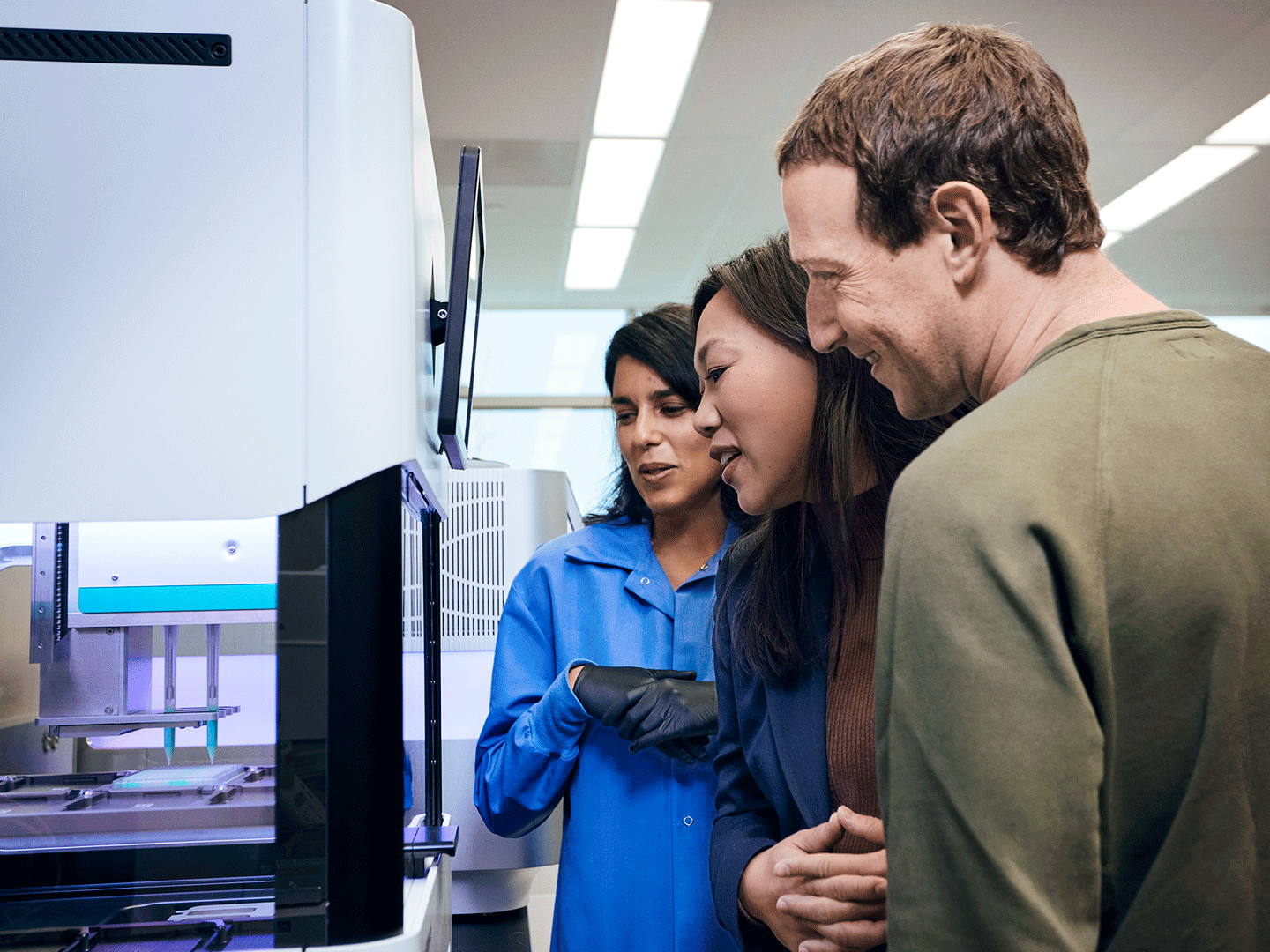 Photo of Chan and Mark Zuckerberg together with Angela Detweiler