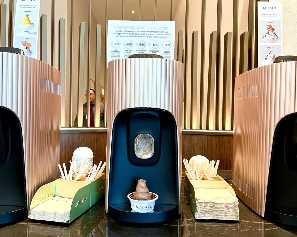 Delta Sky Club gelato solato machine with a cup of chocolate gelato.