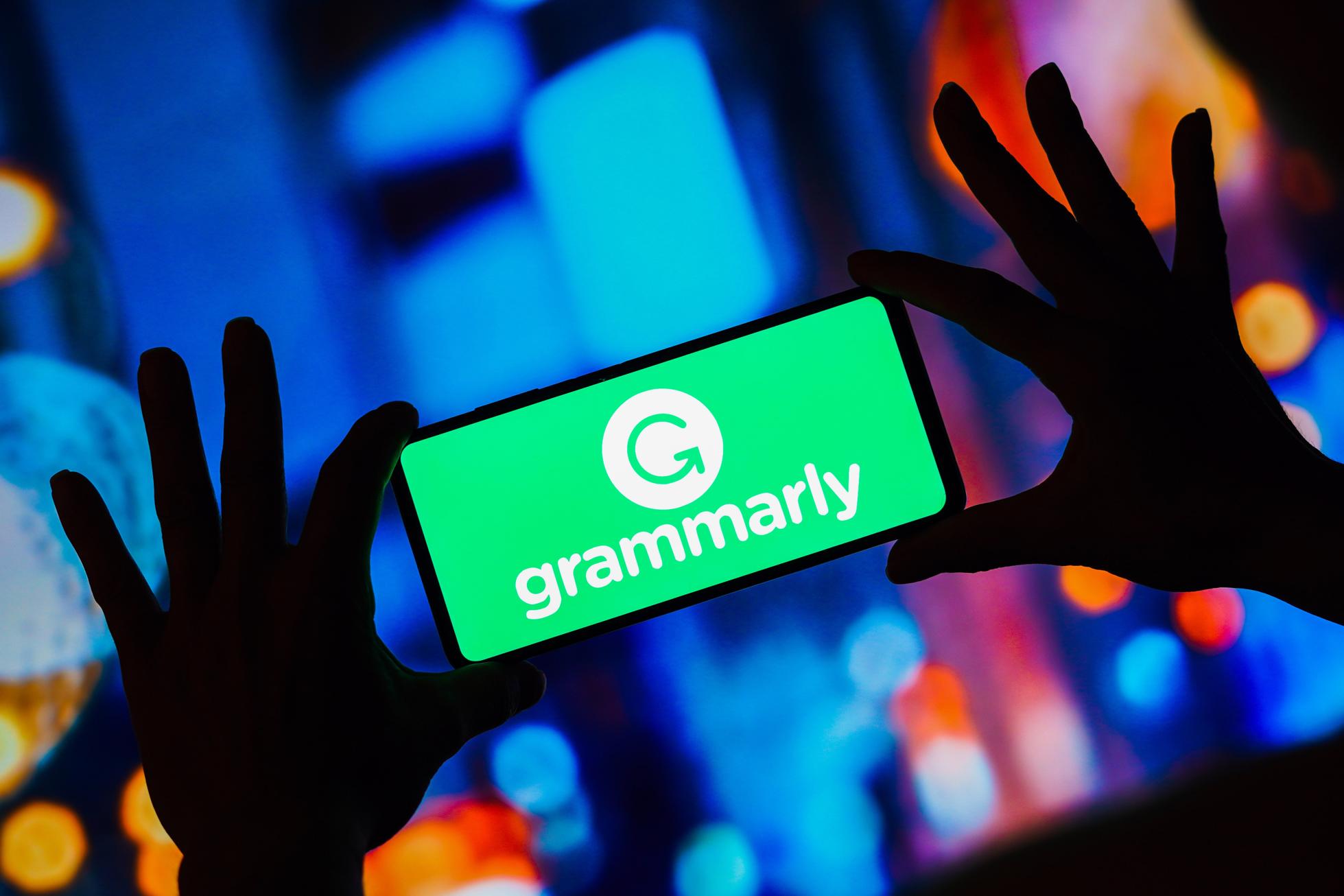 In this photo illustration, the Grammarly logo seen...