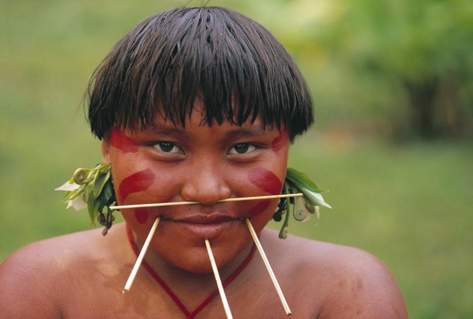 Yanomami woman with wood stick piercing in face