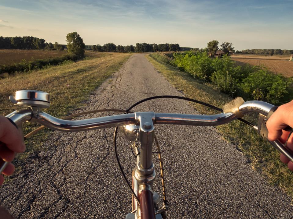 Picture of a bicycle on an asphalt road near Ferrara
