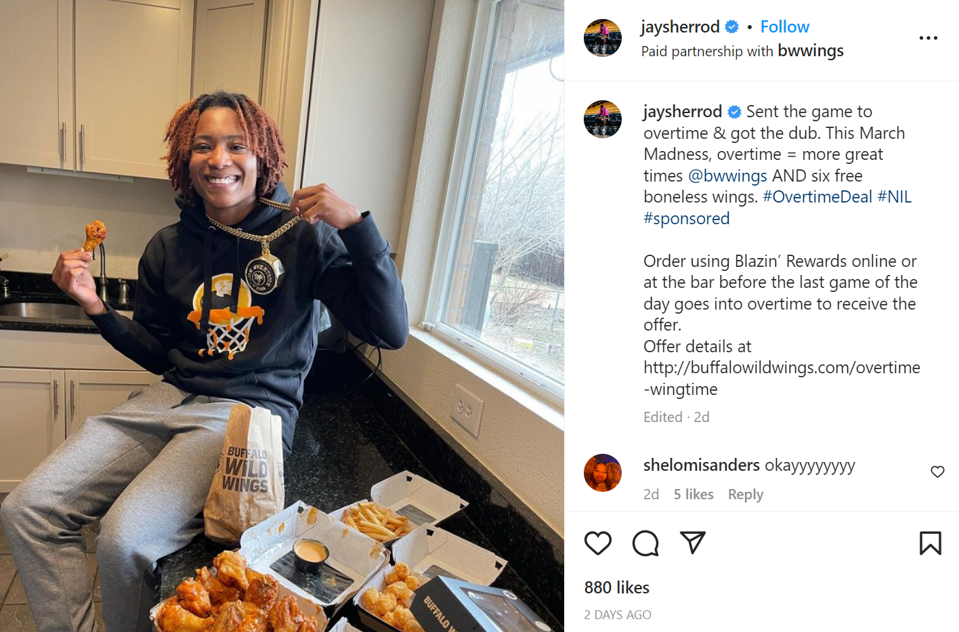 Jaylyn Sherrod with Buffalo Wild Wings meal
