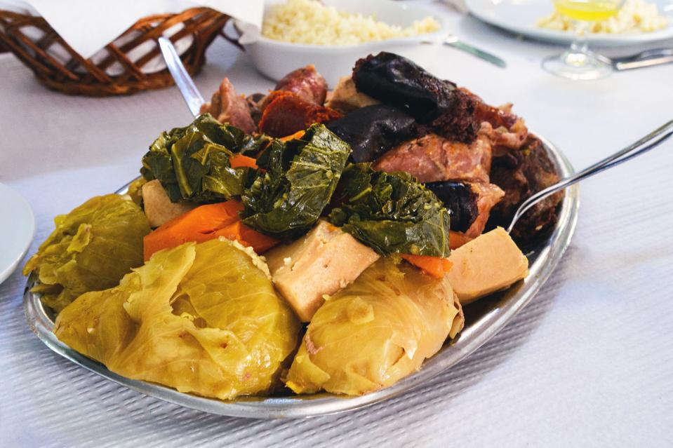 The famous traditional dish of the Azores is Cozido das Furnas. Vegetables and meat are cooked for a long time in hot volcanic soil.″r″nTraditional portuguese food, Azores cuisine, San Miguel, Portugal.