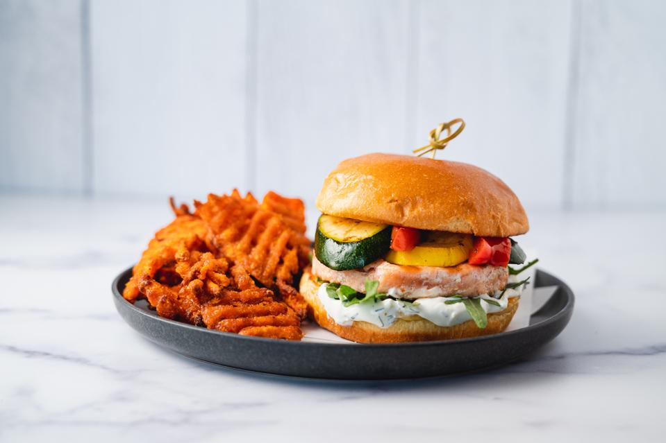 A fish burger and waffle fries