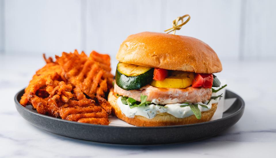 A fish burger and waffle fries