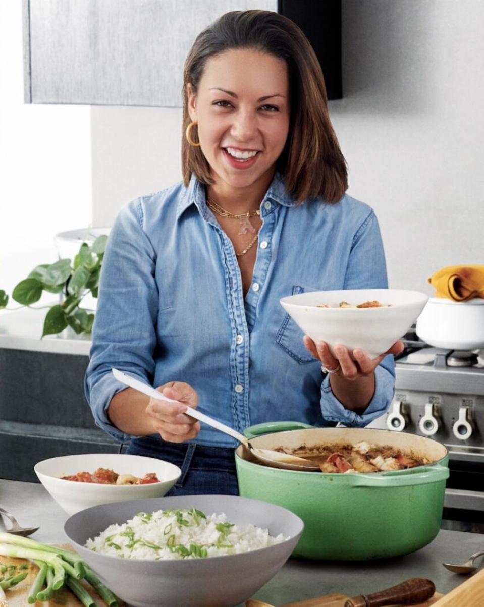 Adrienne Cheatam cooking in her kitchen