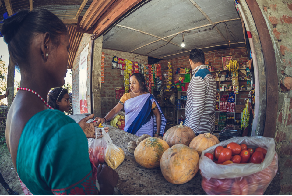 Sanju and Sunita selling healthy food to customers