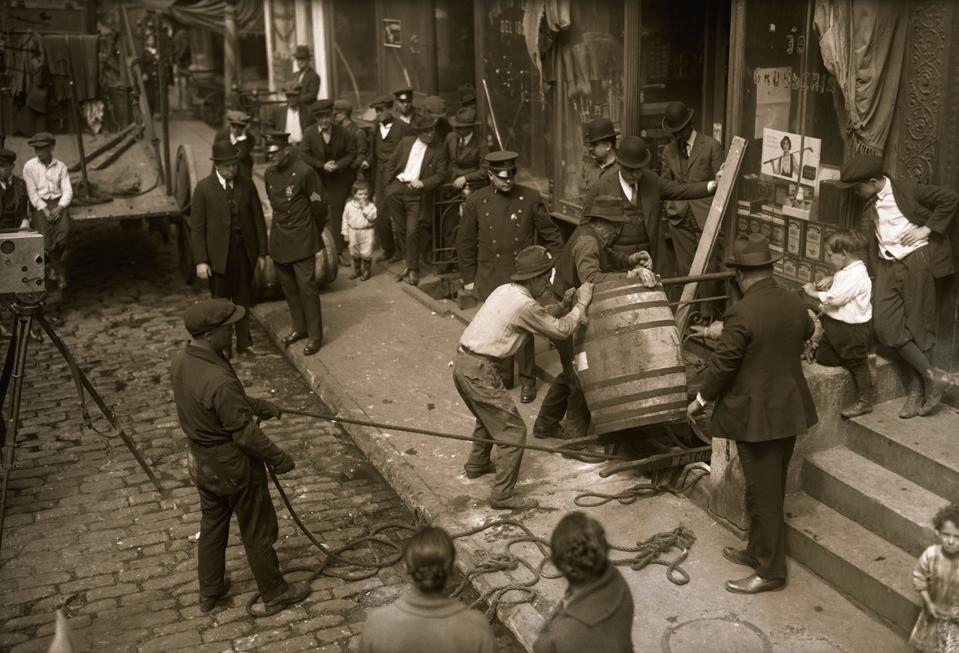 Police and Crowd Watching Men Remove Wine Barrel