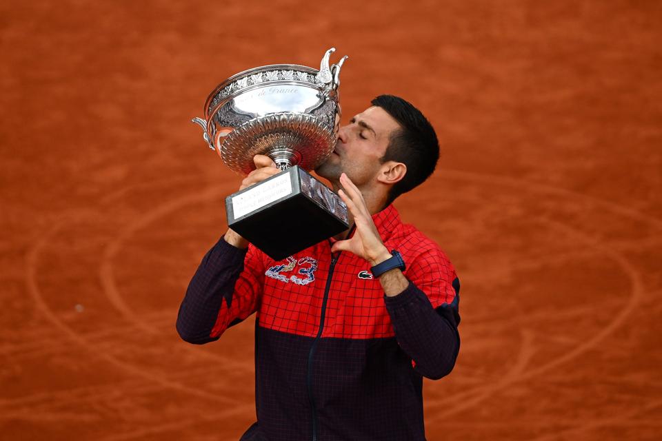 Novak Djokovic with the French Open trophy after he beat Casper Ruud on Sunday.