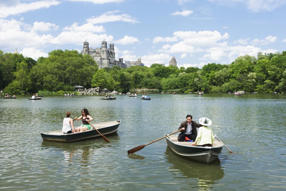 Boaters on Turtle Pond in Central Park Lake, looking out at Belvedere Castle