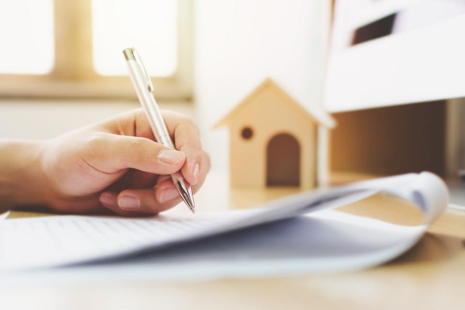 legal concepts paper signing home ownership equity stripping