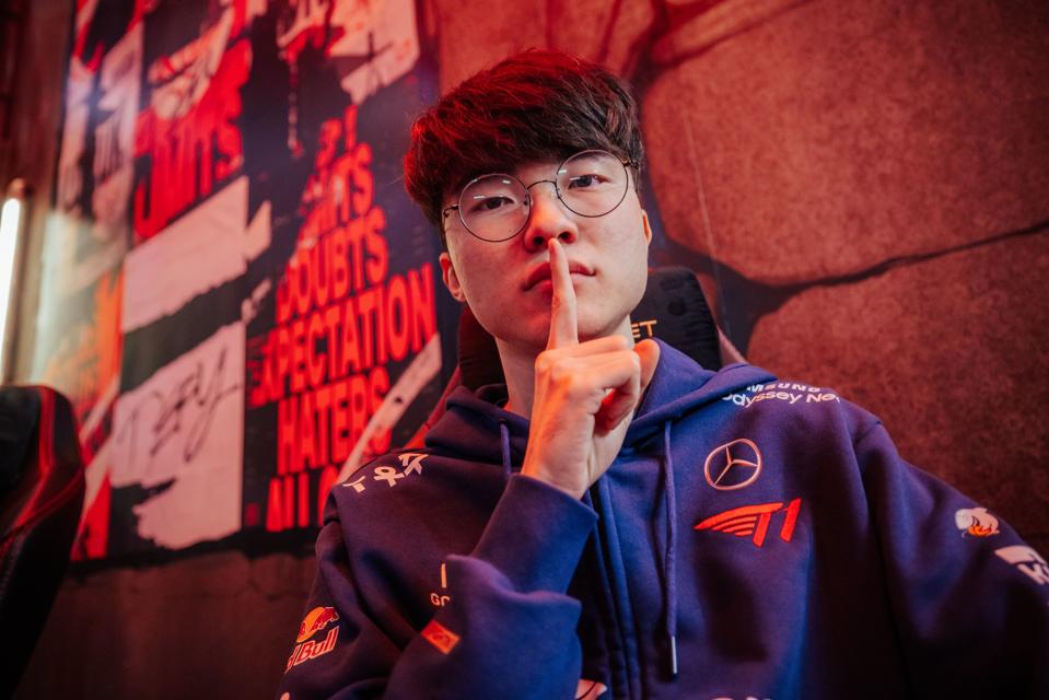 T1 League of Legends player Faker poses for the camera 