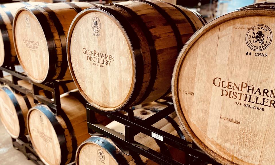 Barrels of whiskey aging at the GlenPharmer Distillery. 