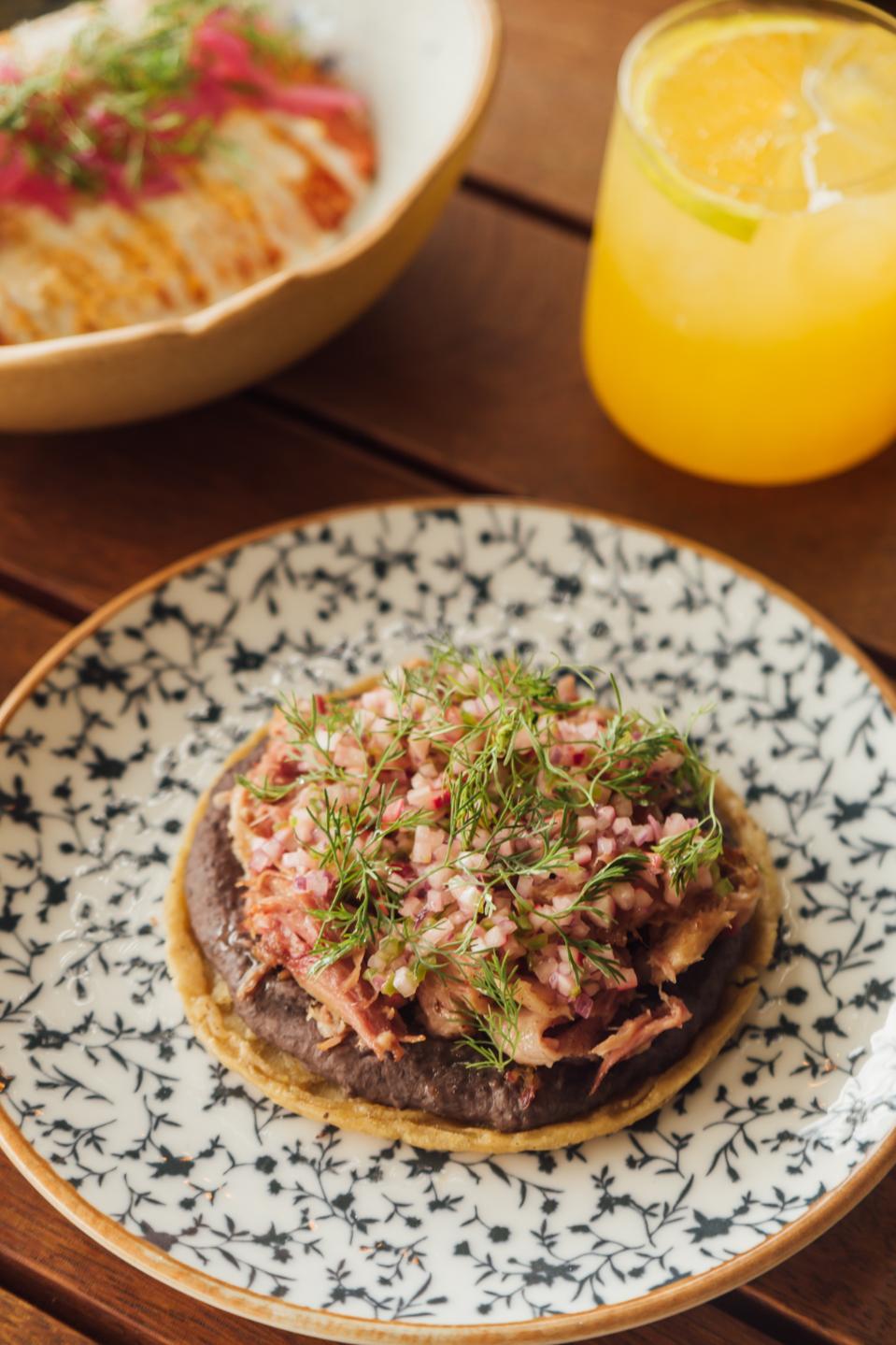 sope de lechon on a blue and white plate