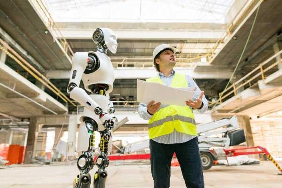 an android assisting a construction worker on a jobsite