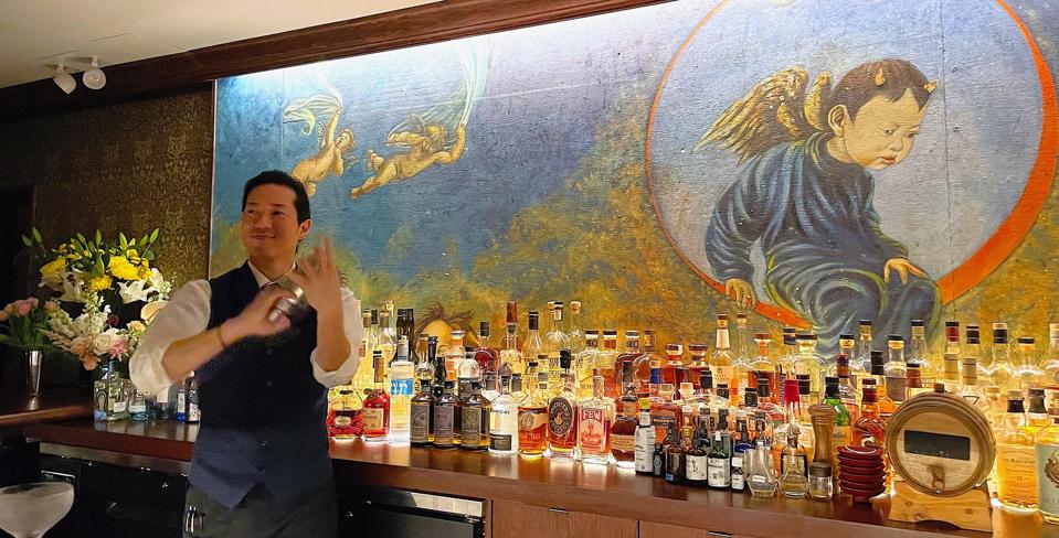 Angel's Share original mural and bartender Tsunetaka Imada at the new bar.