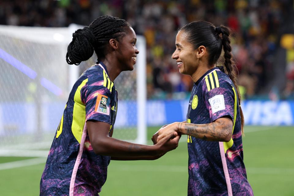 Two Colombia players celebrate at the Women's World Cup 2023.