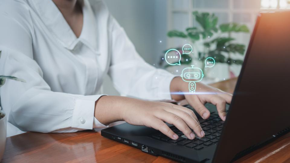 Business woman are working and bringing AI to help them work on computers. Chat with Ai. Chat bot .