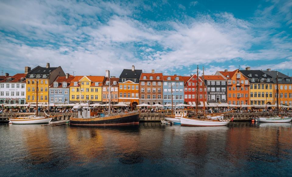 Copenhagen iconic view. Famous old Nyhavn port in the center of Copenhagen, Denmark during