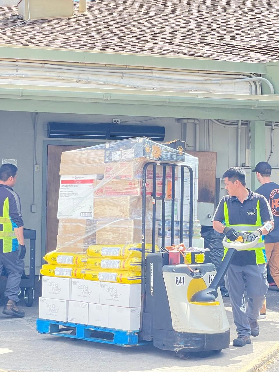 A pallet of relief supplies is being organized for Lahaina fire victims.