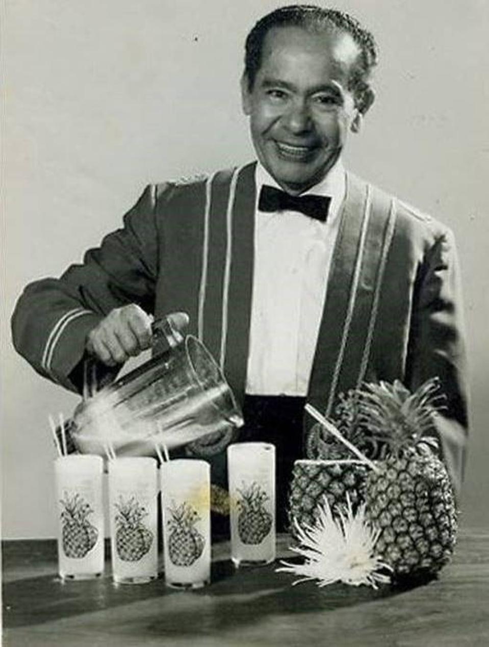 monchito mixing piña coladas