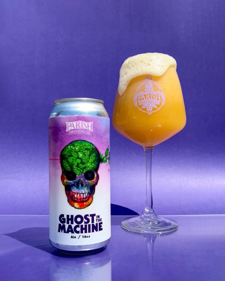 A can of beer with a tall pour in a wine glass.