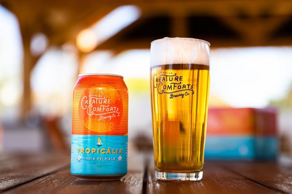 Can or Tropicália beer with a pint glass pour