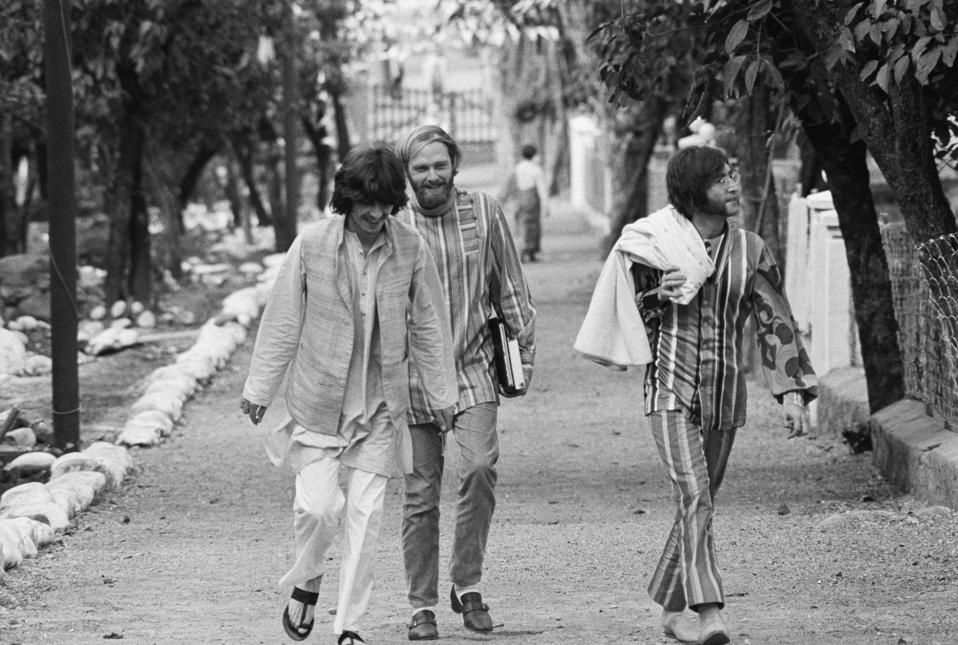 1960s photo of John Lennon with George Harrison and Mike Love in India.