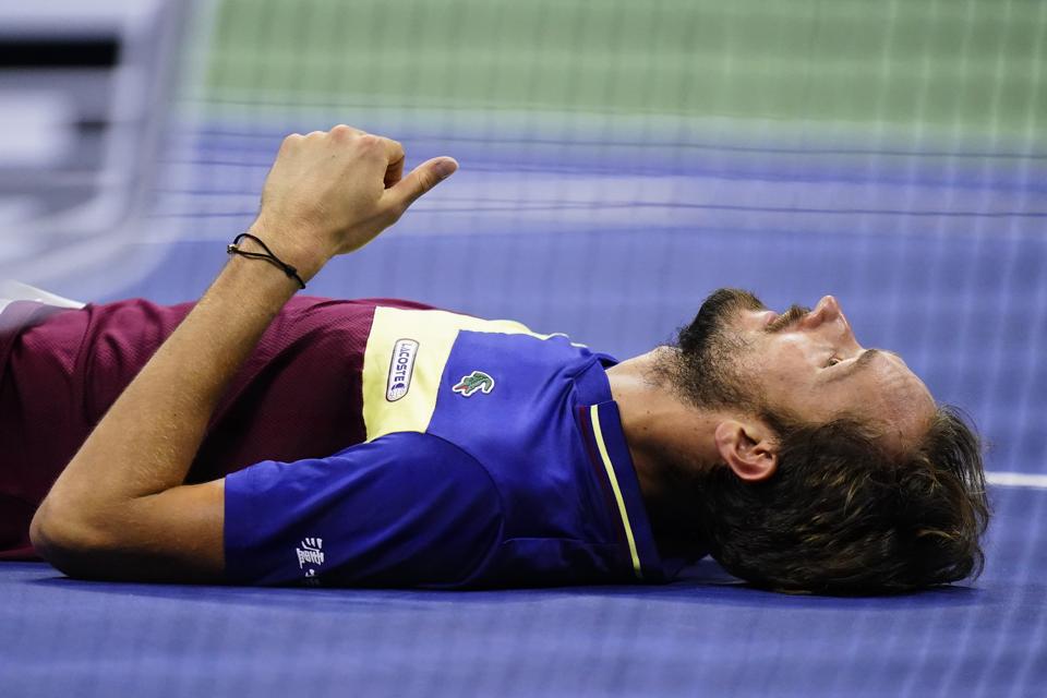 Daniil Medvedev falls during his U.S. Open final defeat against Novak Djokovic.