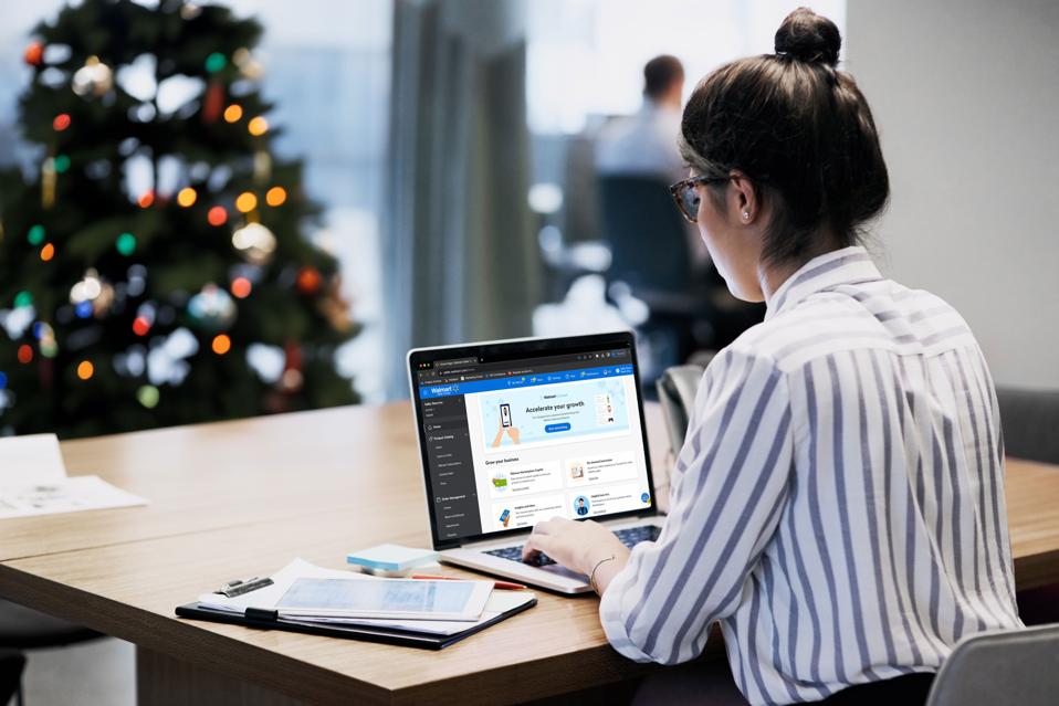 Girl on her computer online shopping around Christmas time.