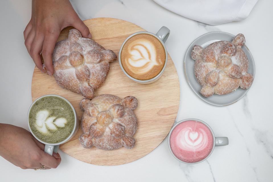 Andaz Pan de muerto and cups of hot drinks