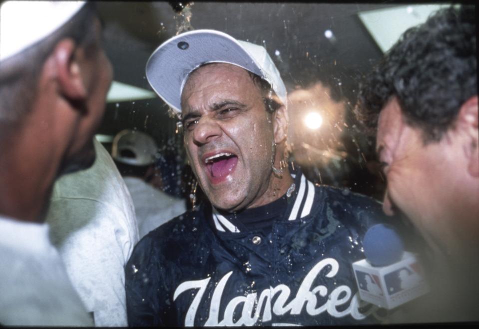 Joe Torre celebrates winning the 1996 World Series.