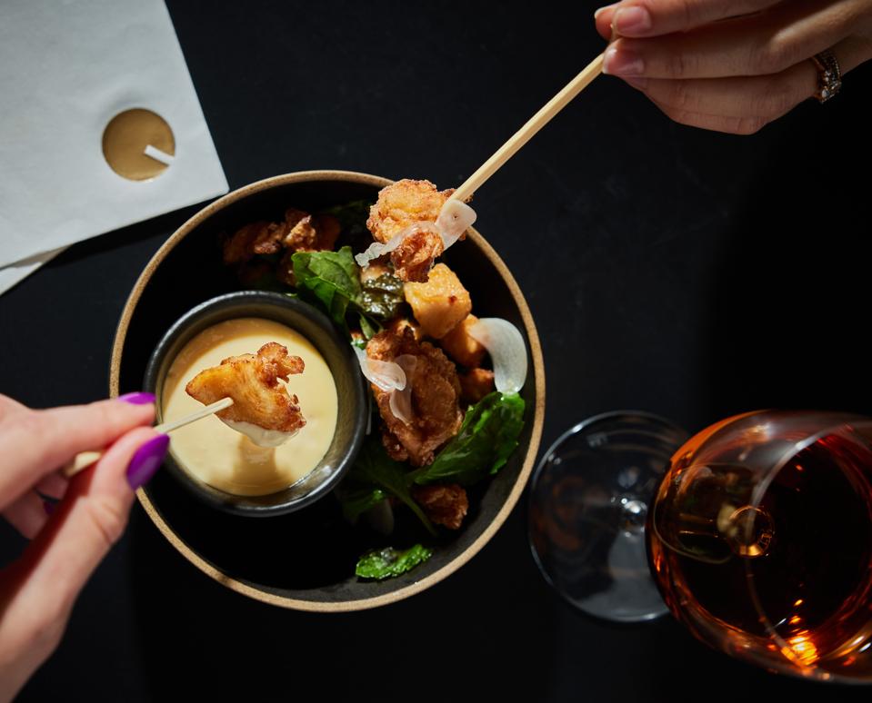 Chicken Karaage with pickled garlic, fresh herbs and kewpie mayo.