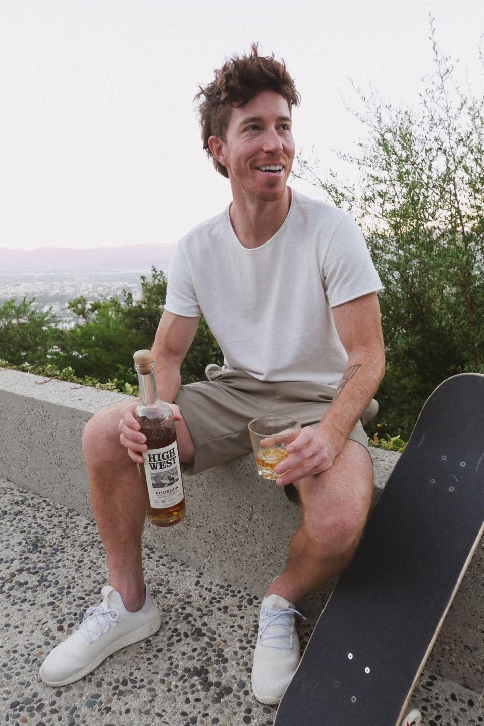 Shaun White with a bottle of his favorite whiskey from High West.