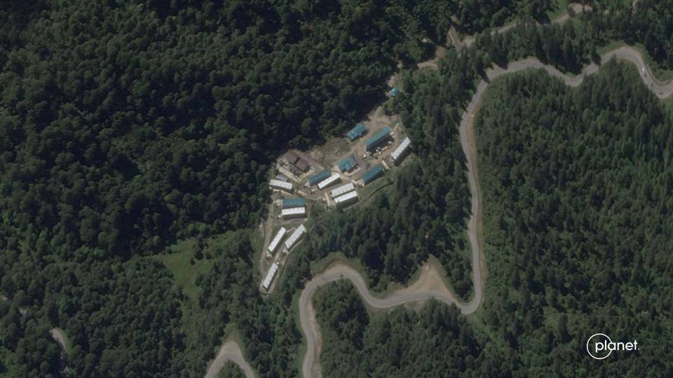 The site in Dochula sits alongside a public road but is largely hidden by the landscape.