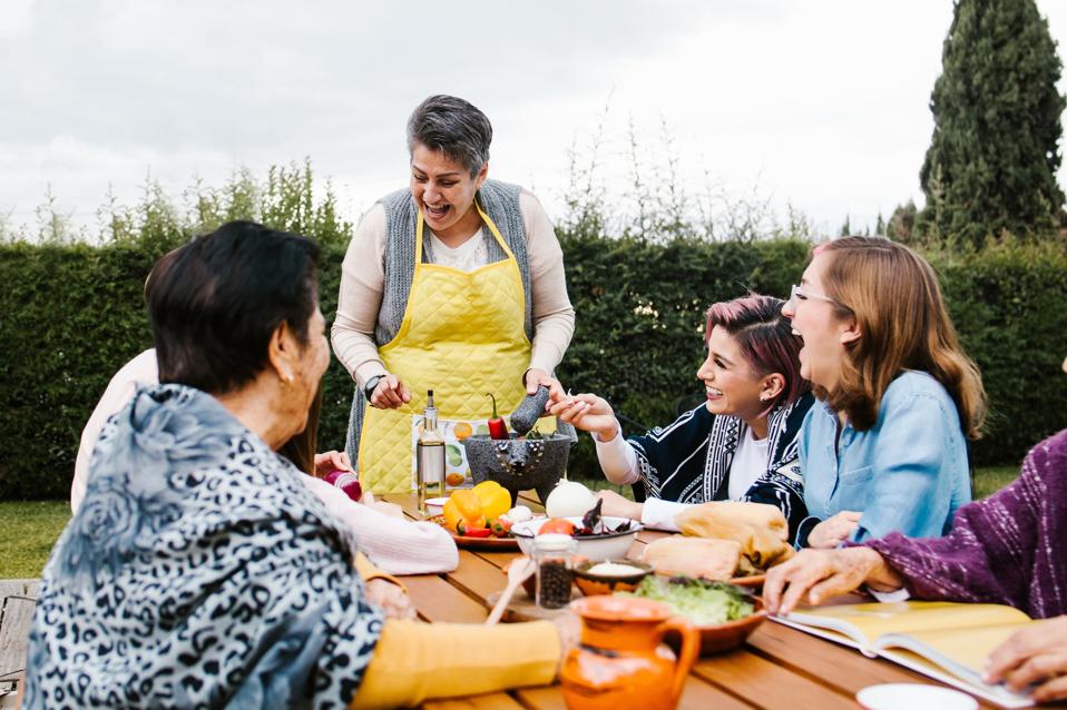 latin mother and daughter cooking together mexican food at home in Mexico city