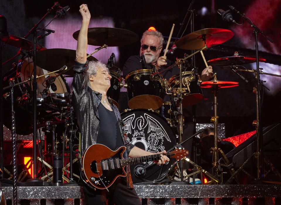 Brian May (left) and Roger Taylor (center) perform on stage with Queen + Adam Lambert during 'The Rhapsody Tour.' Monday, October 30, 2023 at United Center in Chicago, IL (Photo by Barry Brecheisen)